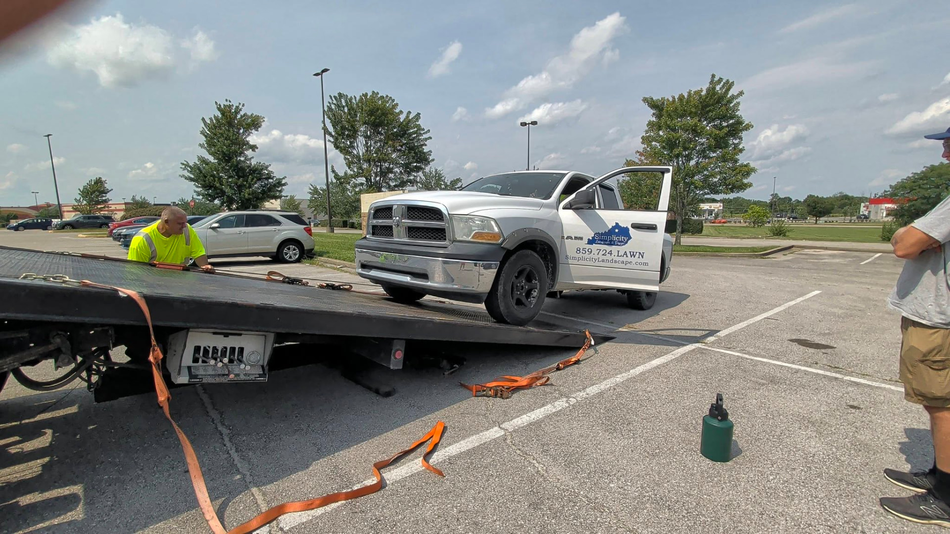 A pickup truck loaded onto the flatbed tilted down