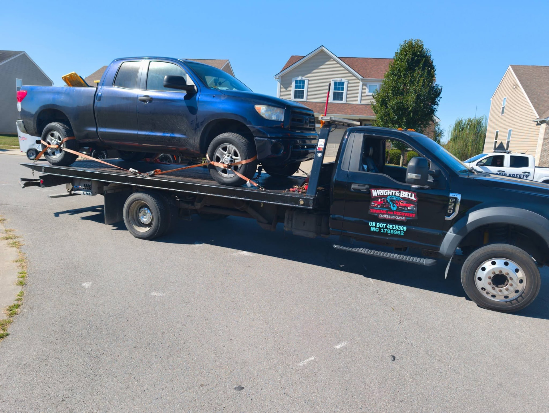 A pickup truck loaded onto the flatbed